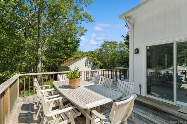 a view of balcony with furniture and wooden deck