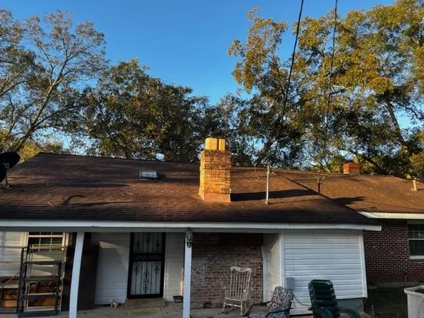a view of a building with a tree