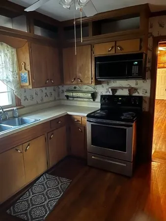 a kitchen with a stove and a microwave