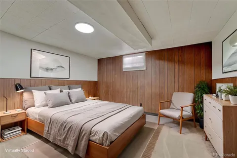 a bedroom with a bed and chair