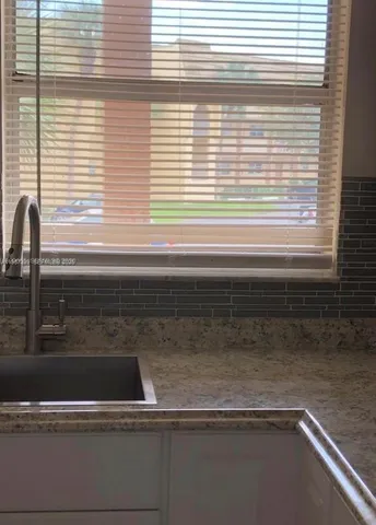 a bathroom sink with a window