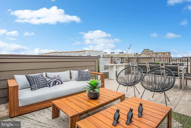 a view of a balcony with furniture