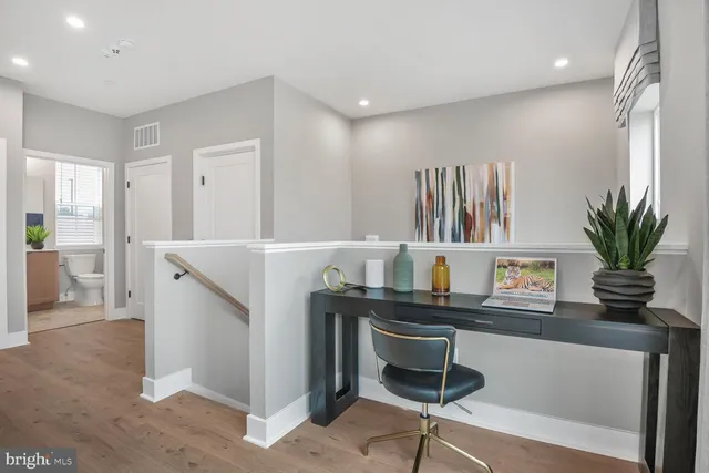 a room with furniture and a potted plant