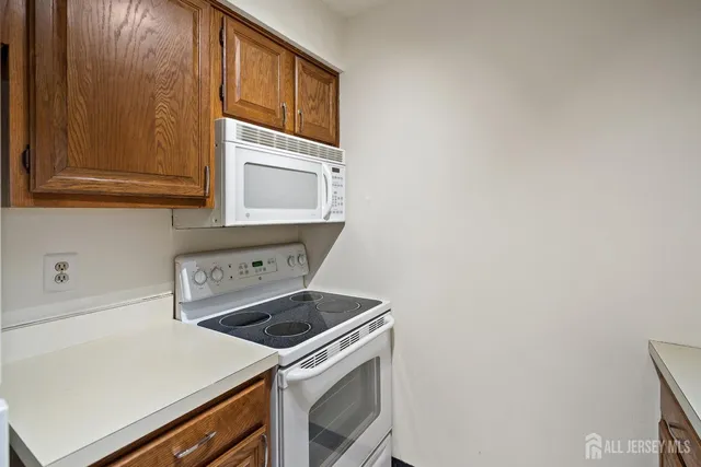 a kitchen with a sink and a refrigerator