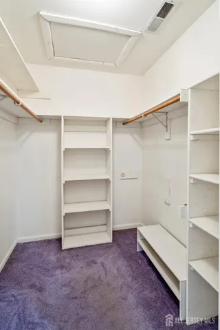 a bathroom with a sink toilet vanity and shower