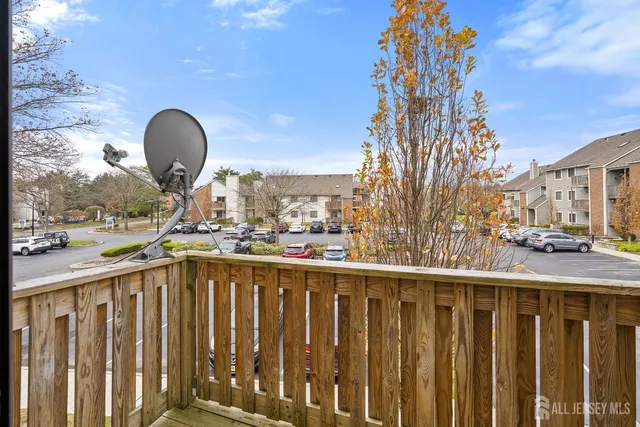 a view of a house with a deck and a door