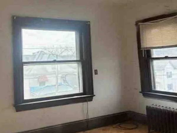a view of a room that has a window in it