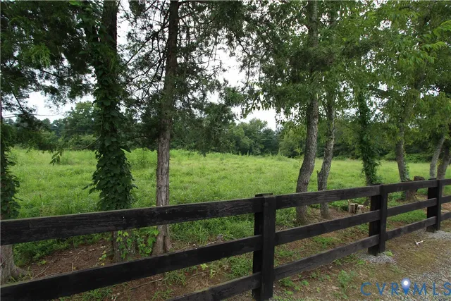 a view of a bench in the middle of a garden