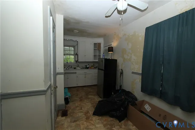 a kitchen with a refrigerator and a sink