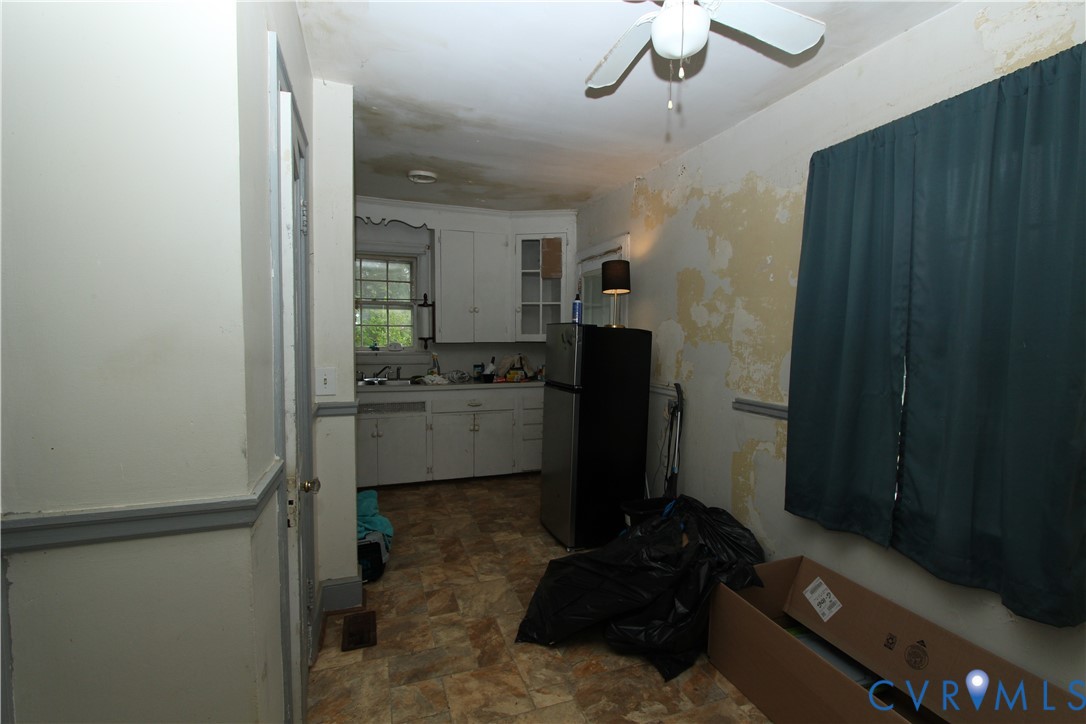 17037 Beaver Dam Road Beaverdam, VA 23015 - Photo 7 of 27 a kitchen with a refrigerator and a sink