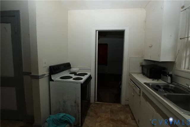 a kitchen with a stove and a refrigerator