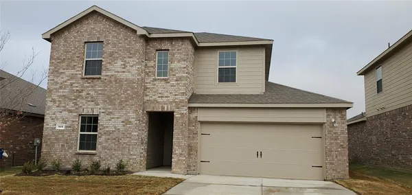a front view of a house with garage