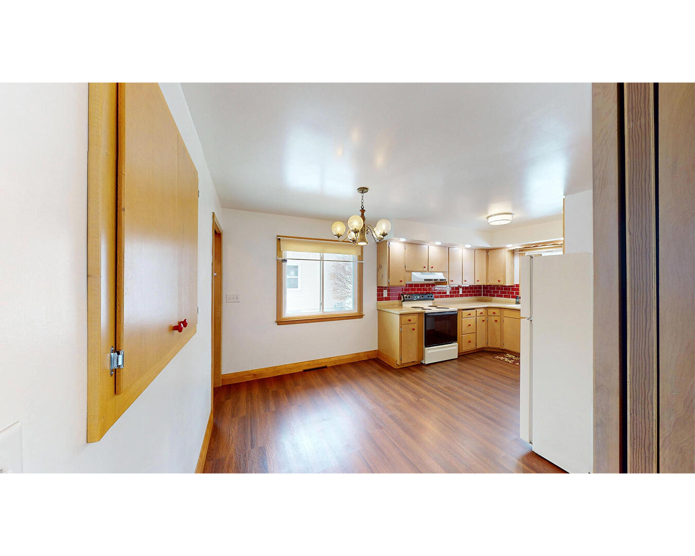 1525 George Street Manitowoc, WI 54220 - Photo 6 of 29 Kitchen from hall, pocket doors
