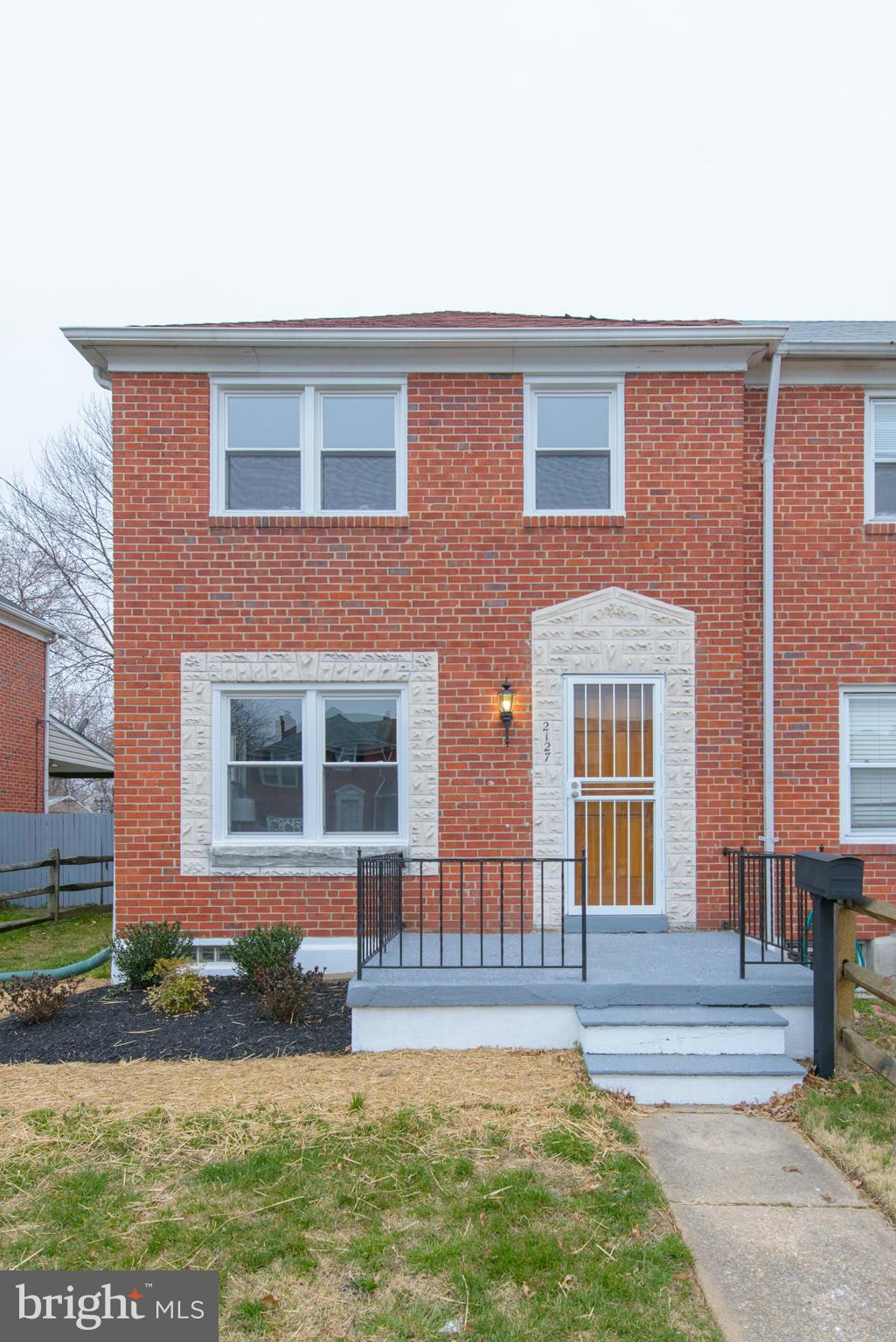2127 Firethorn Road Baltimore, MD 21220 - Photo 1 of 30 a front view of a house with garden