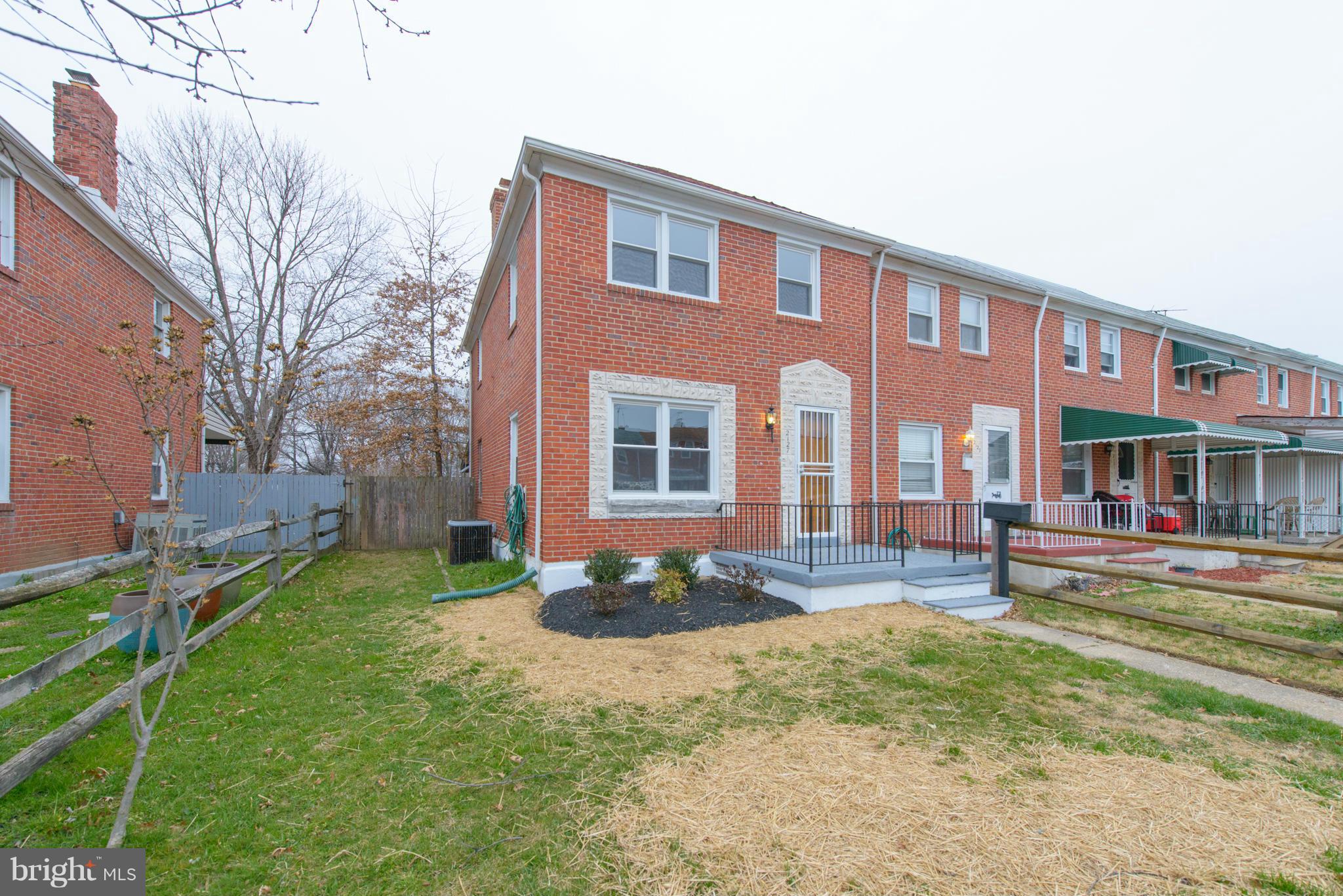 2127 Firethorn Road Baltimore, MD 21220 - Photo 2 of 30 a front view of a house with a yard