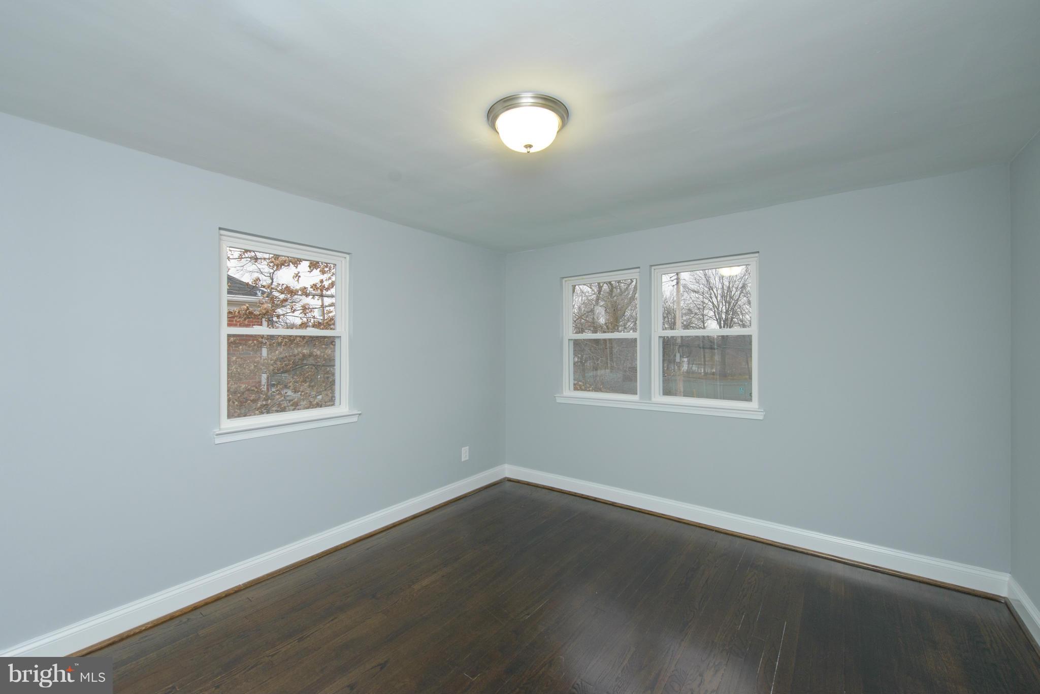 2127 Firethorn Road Baltimore, MD 21220 - Photo 16 of 30 an empty room with wooden floor and windows