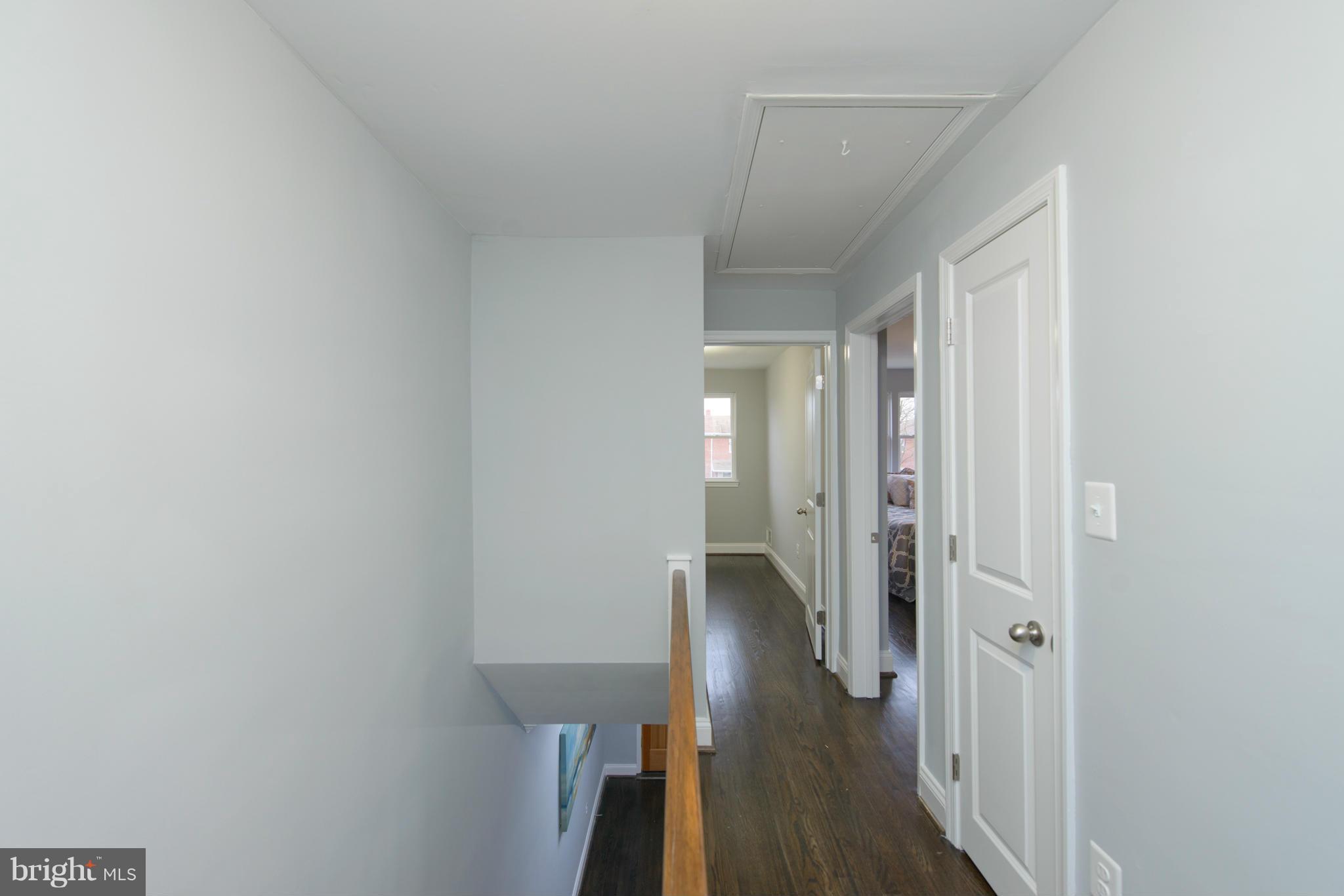 2127 Firethorn Road Baltimore, MD 21220 - Photo 20 of 30 a view of a hallway with wooden floor