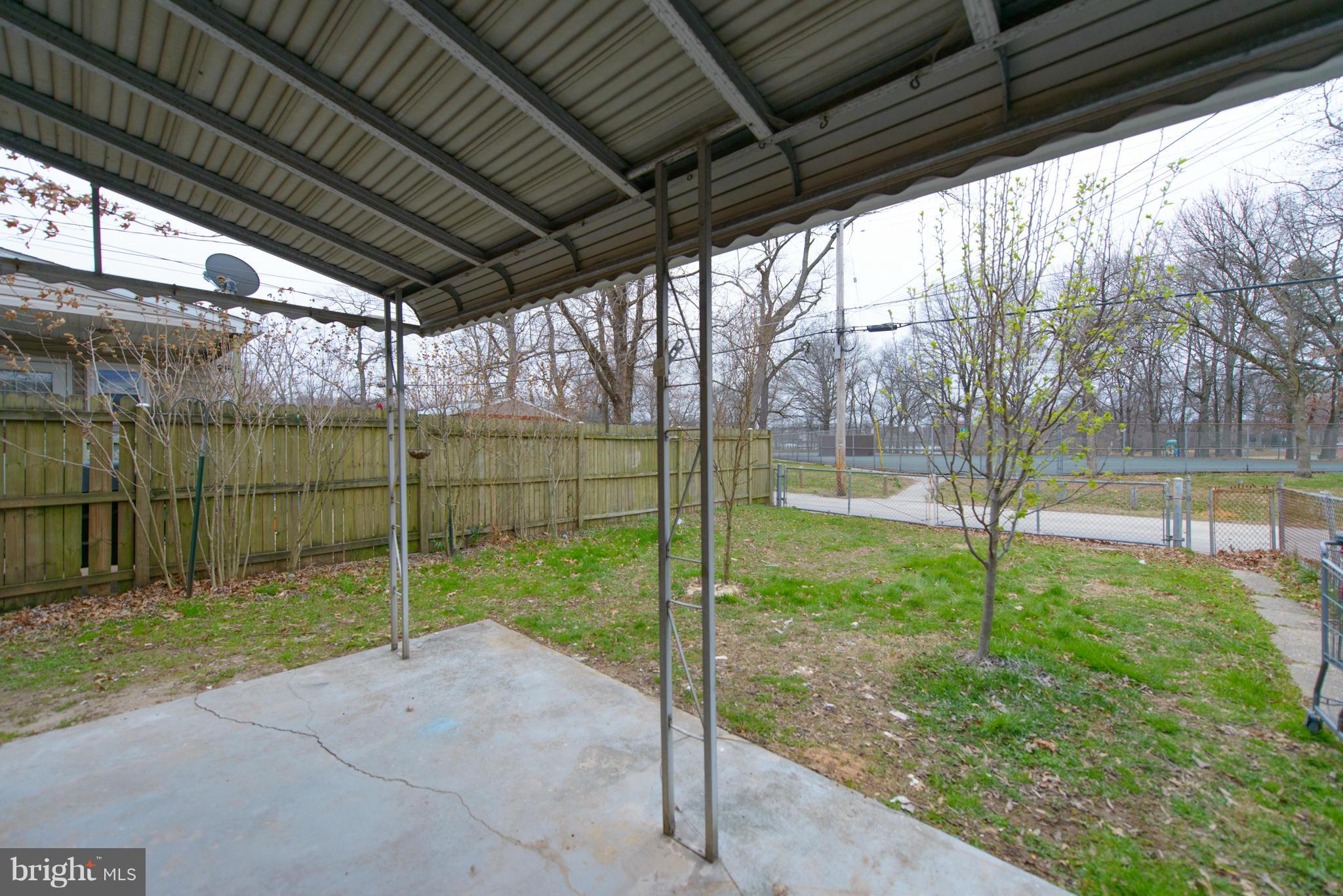 2127 Firethorn Road Baltimore, MD 21220 - Photo 27 of 30 a view of a deck with a big yard