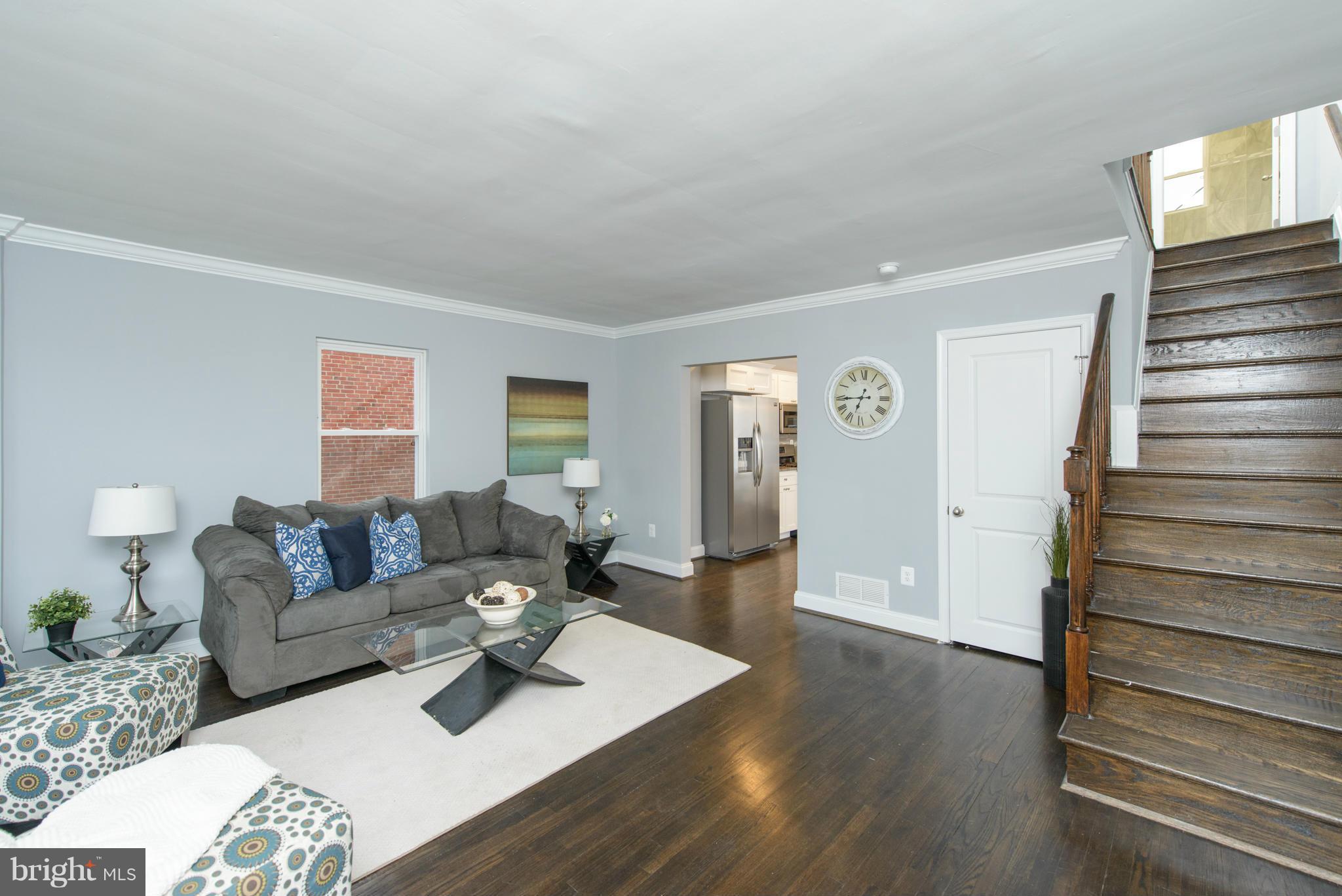 2127 Firethorn Road Baltimore, MD 21220 - Photo 4 of 30 a living room with furniture and wooden floor