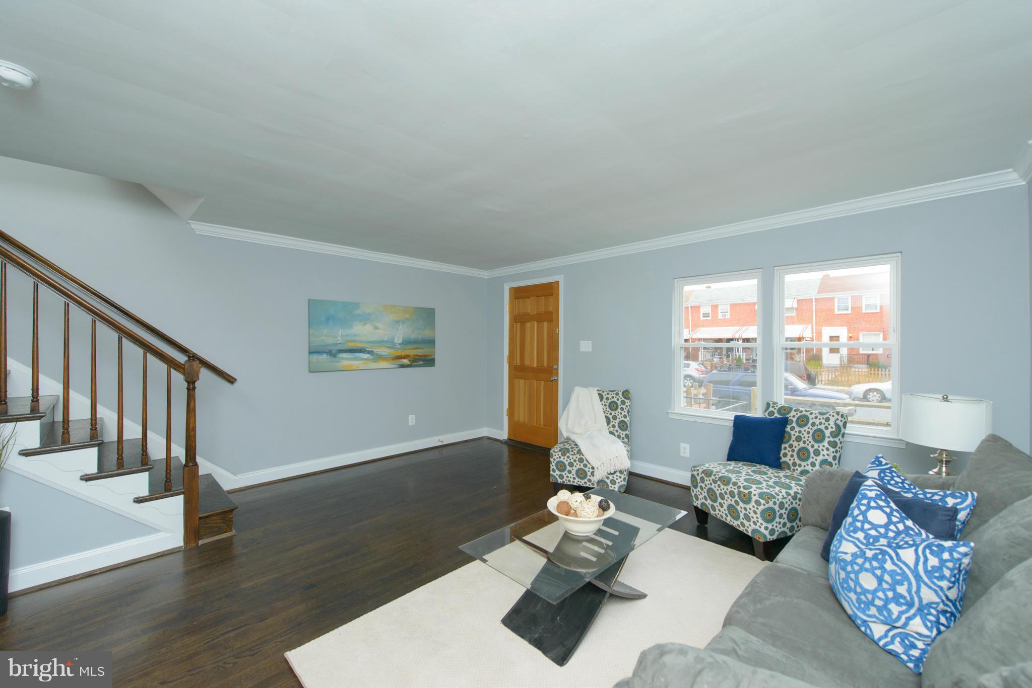 2127 Firethorn Road Baltimore, MD 21220 - Photo 5 of 30 a living room with furniture and wooden floor