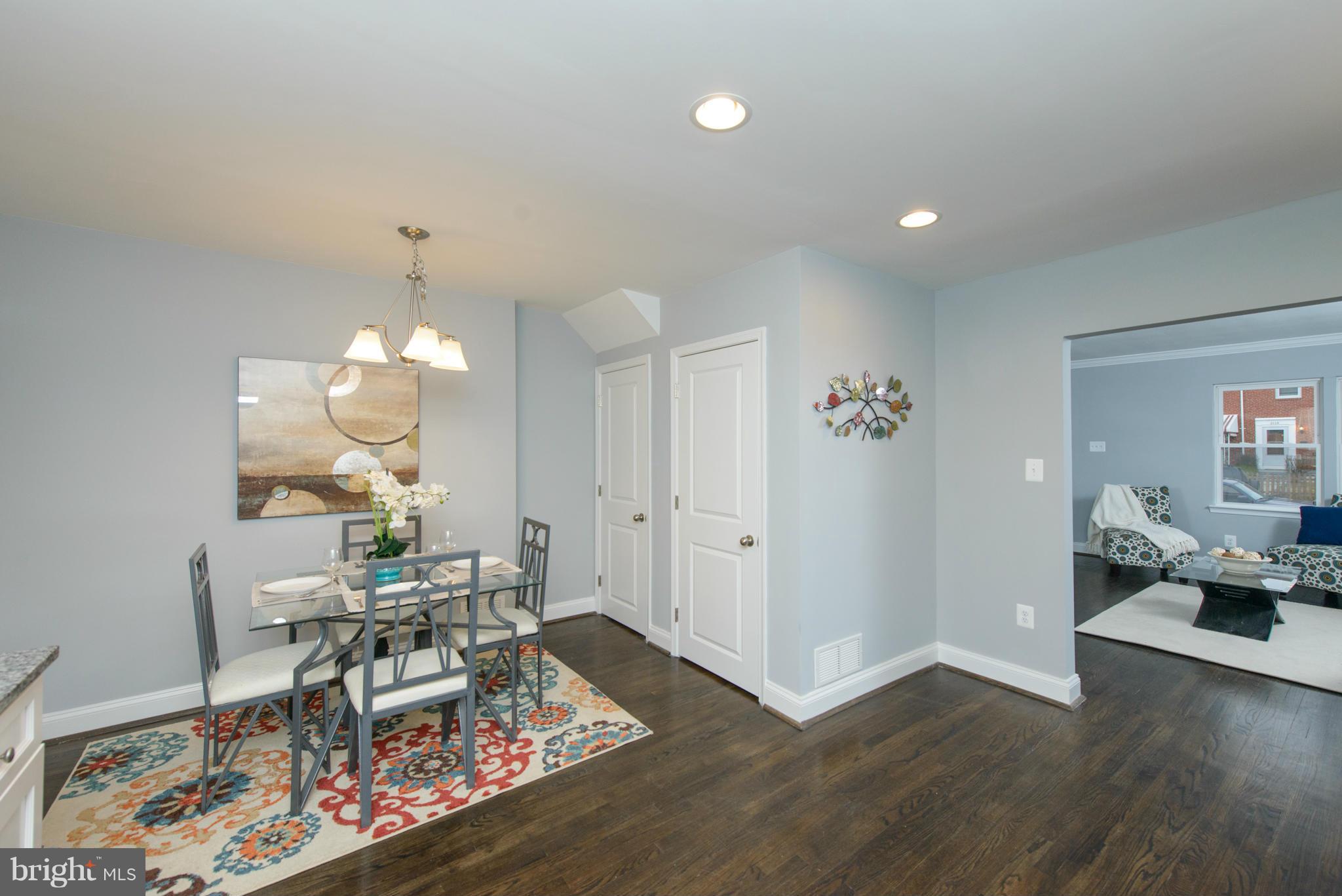 2127 Firethorn Road Baltimore, MD 21220 - Photo 7 of 30 a view of a dining room with furniture and wooden floor