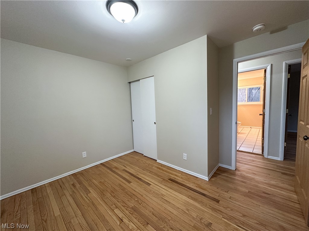 615 Liberty Road Youngstown, OH 44505 - Photo 13 of 22 Bedroom featuring a closet and light hardwood flooring