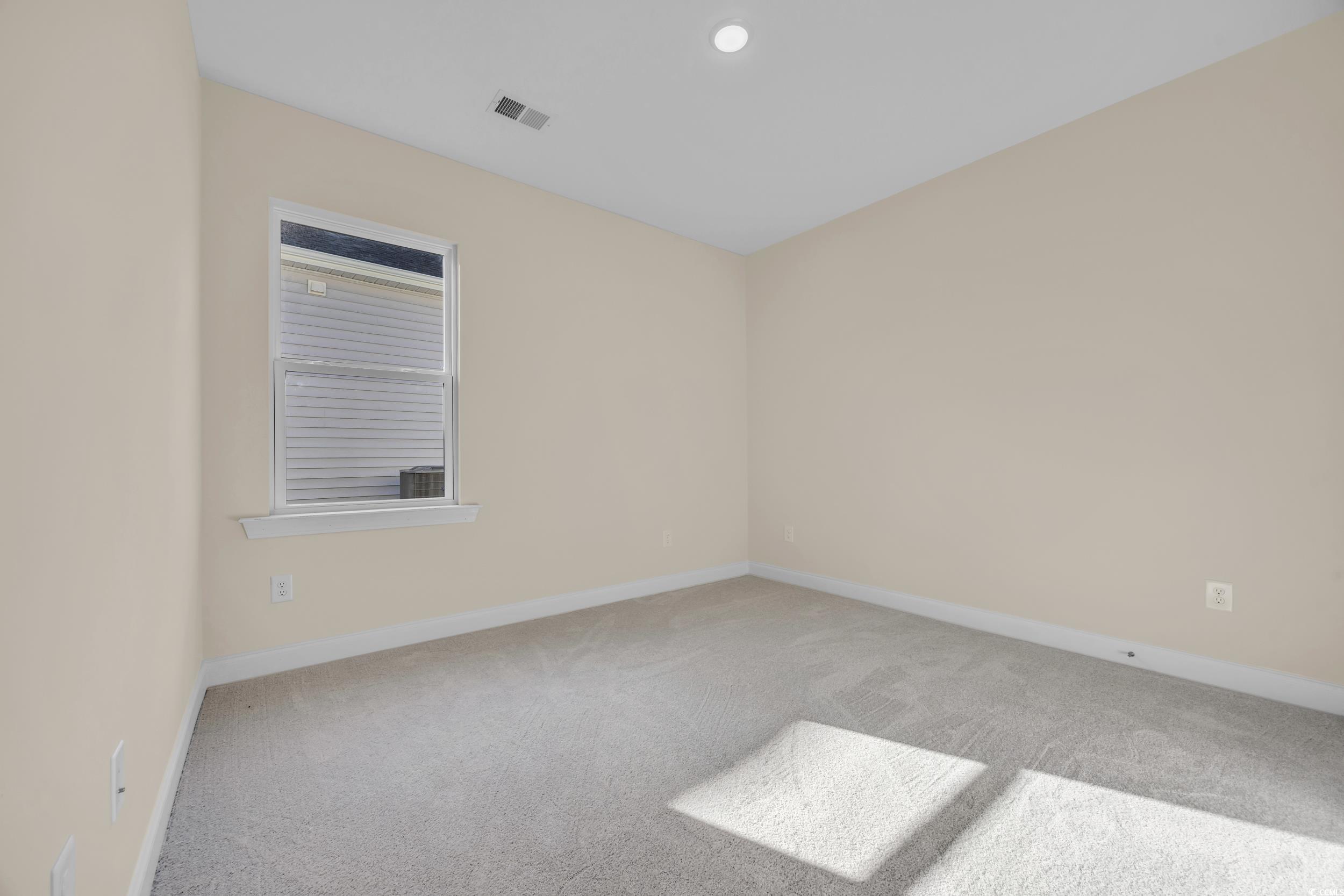 547 Beckham Court Murrells Inlet, SC 29576 - Photo 14 of 40 Empty room featuring light carpet