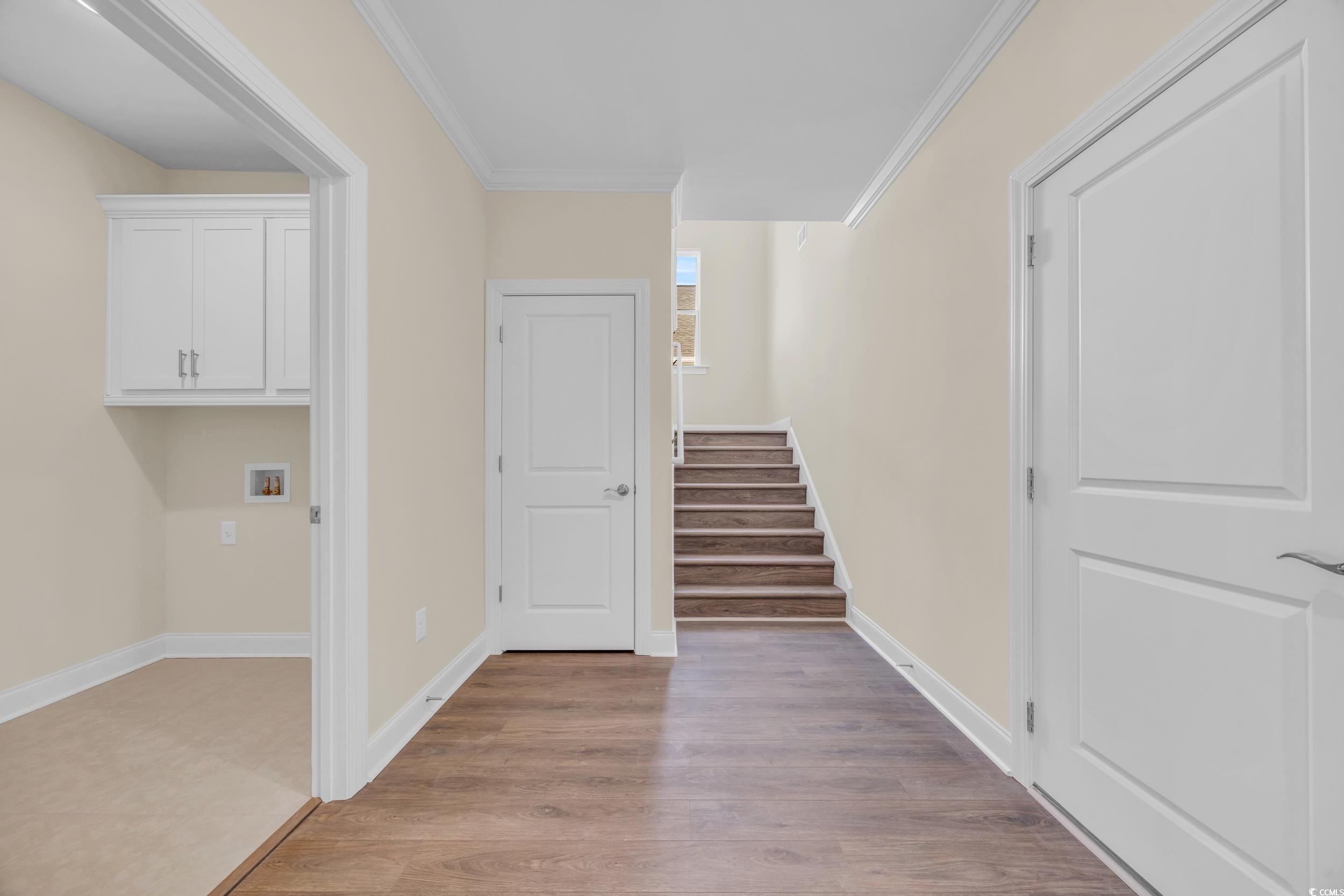 547 Beckham Court Murrells Inlet, SC 29576 - Photo 21 of 40 Stairway featuring ornamental molding and hardwood