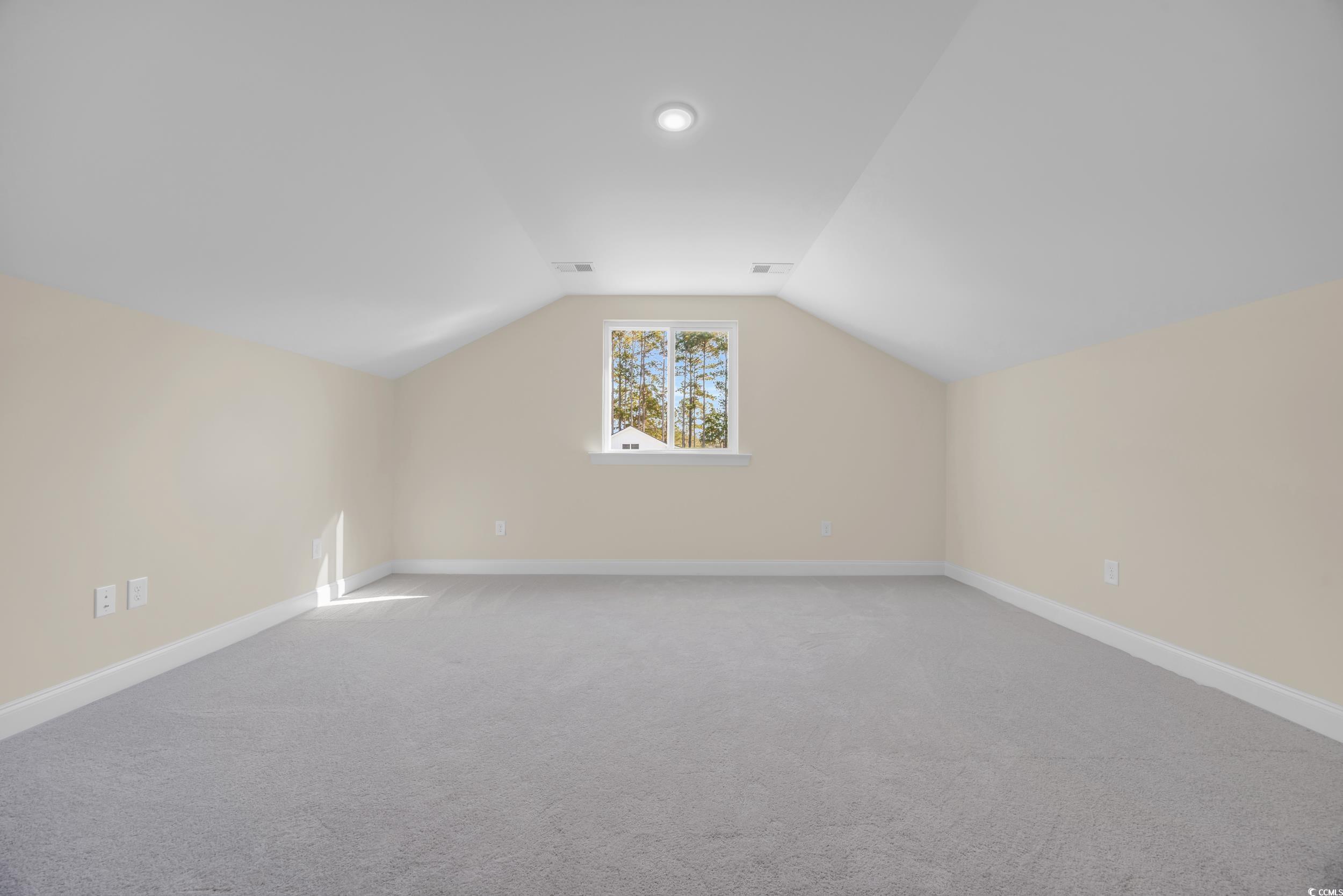 547 Beckham Court Murrells Inlet, SC 29576 - Photo 23 of 40 Bonus room with light carpet and vaulted ceiling