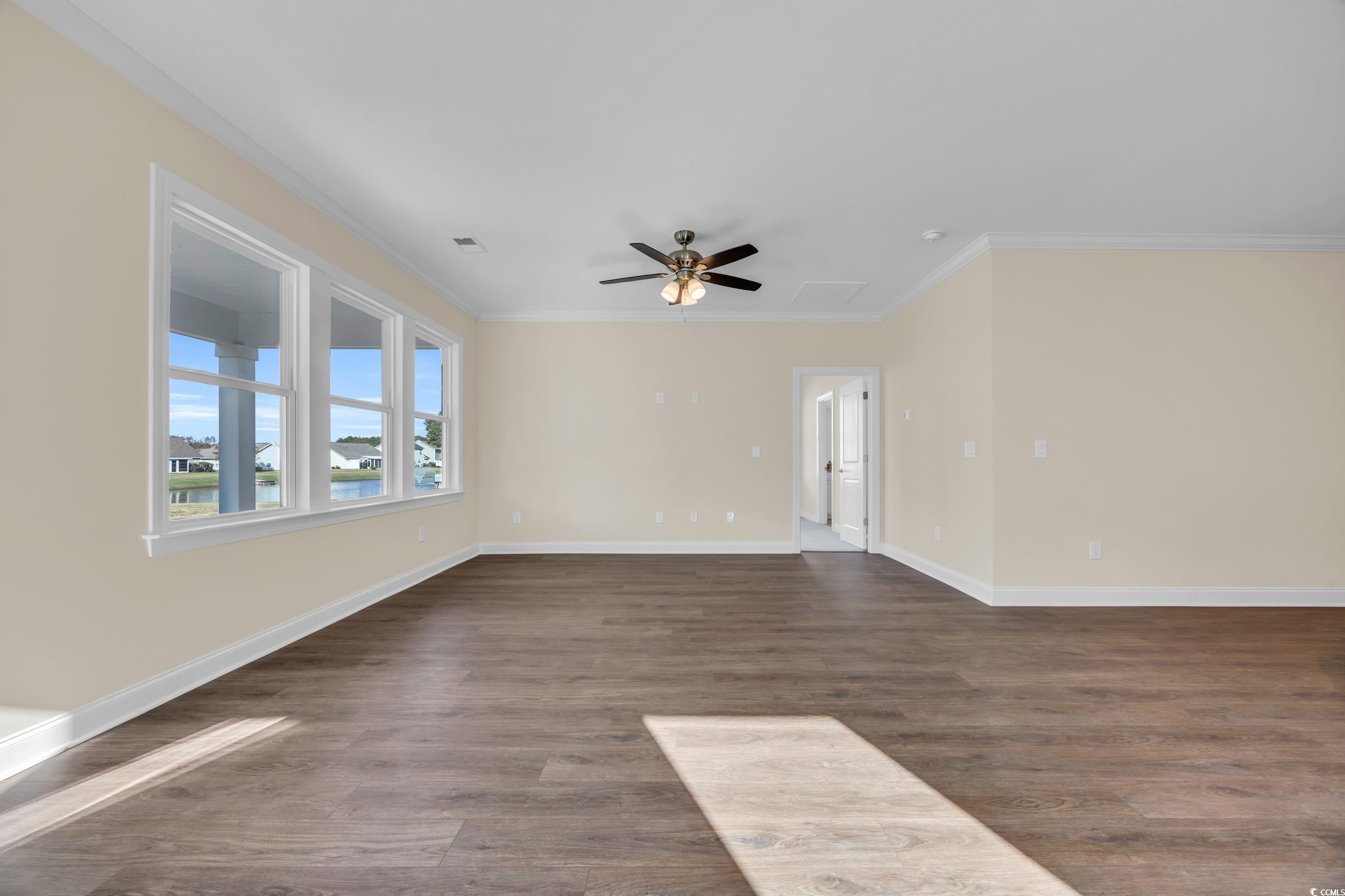 547 Beckham Court Murrells Inlet, SC 29576 - Photo 3 of 40 Spare room with ornamental molding, ceiling fan, a
