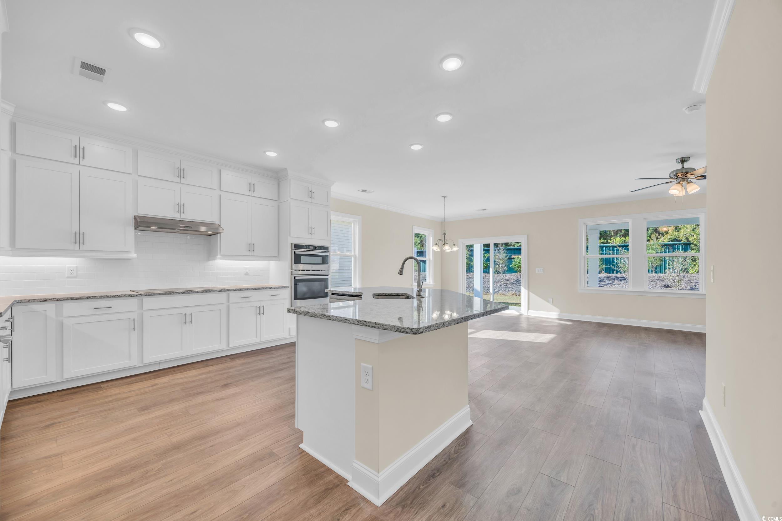 547 Beckham Court Murrells Inlet, SC 29576 - Photo 8 of 40 Kitchen featuring light hardwood / wood-style floo