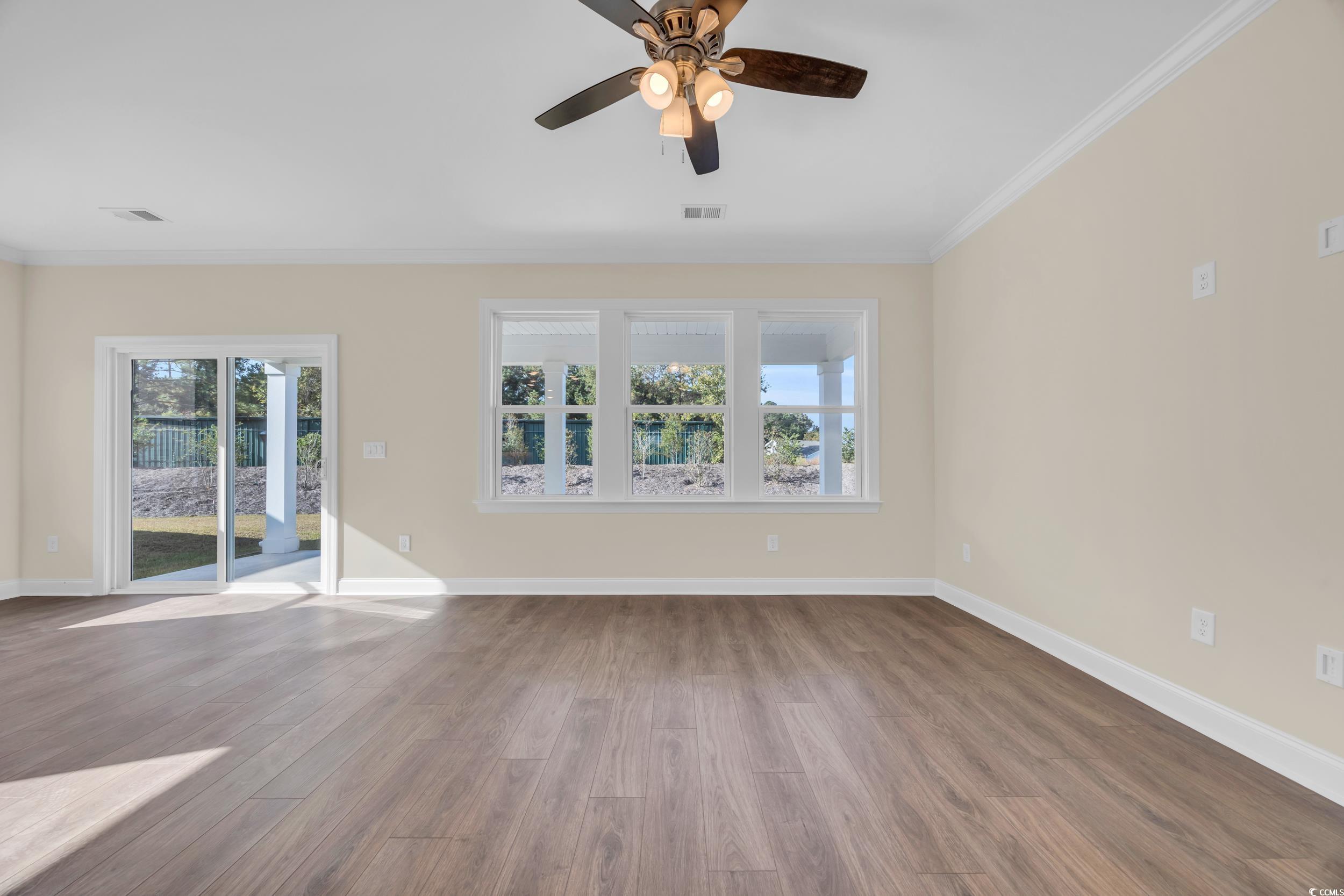 547 Beckham Court Murrells Inlet, SC 29576 - Photo 10 of 40 Empty room with ornamental molding, hardwood / woo