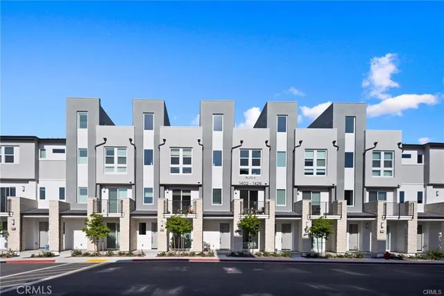 front view of a brick building with many windows
