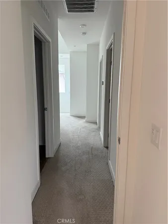 a bathroom with a shower and a sink