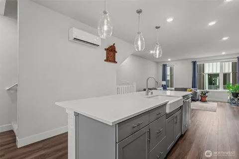 an open kitchen with a sink and dish washer