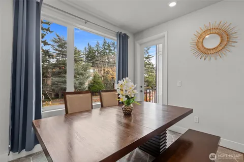 a living room with furniture and with potted plants
