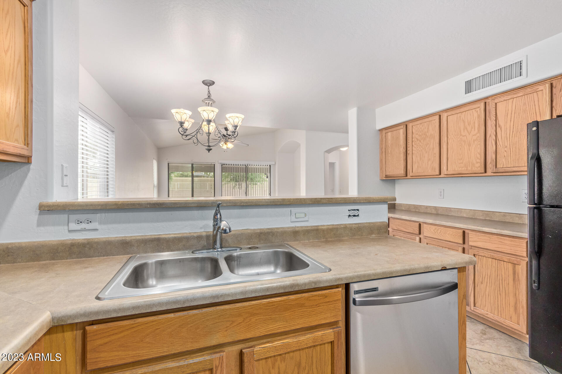 2521 West Desert Spring Way Queen Creek, AZ 85144 - Photo 18 of 39 a kitchen with a sink and a window