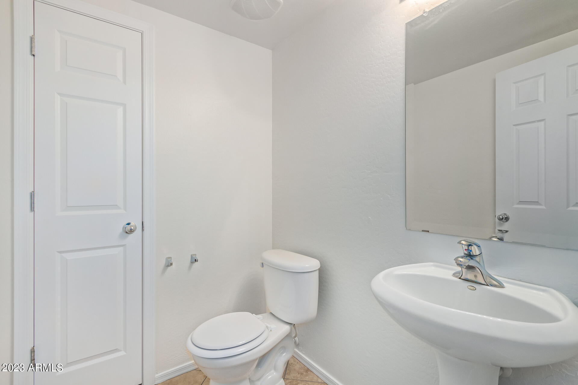 2521 West Desert Spring Way Queen Creek, AZ 85144 - Photo 20 of 39 a bathroom with a toilet a sink and a mirror