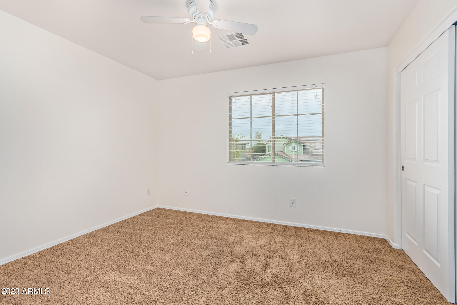 2521 West Desert Spring Way Queen Creek, AZ 85144 - Photo 29 of 39 an empty room with a window