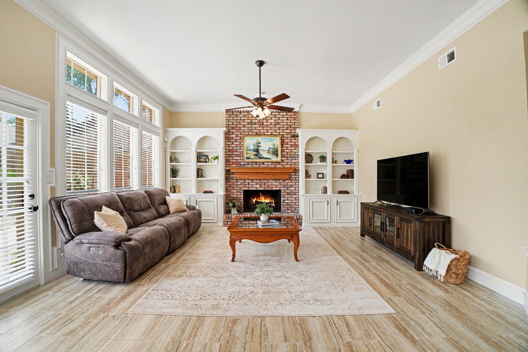 3411 Fir Forest Drive Spring, TX 77388 - Photo 14 of 39 The family room is conveniently connected to the kitchen and features a floor-to-ceiling Chicago brick fireplace and custom built-ins.