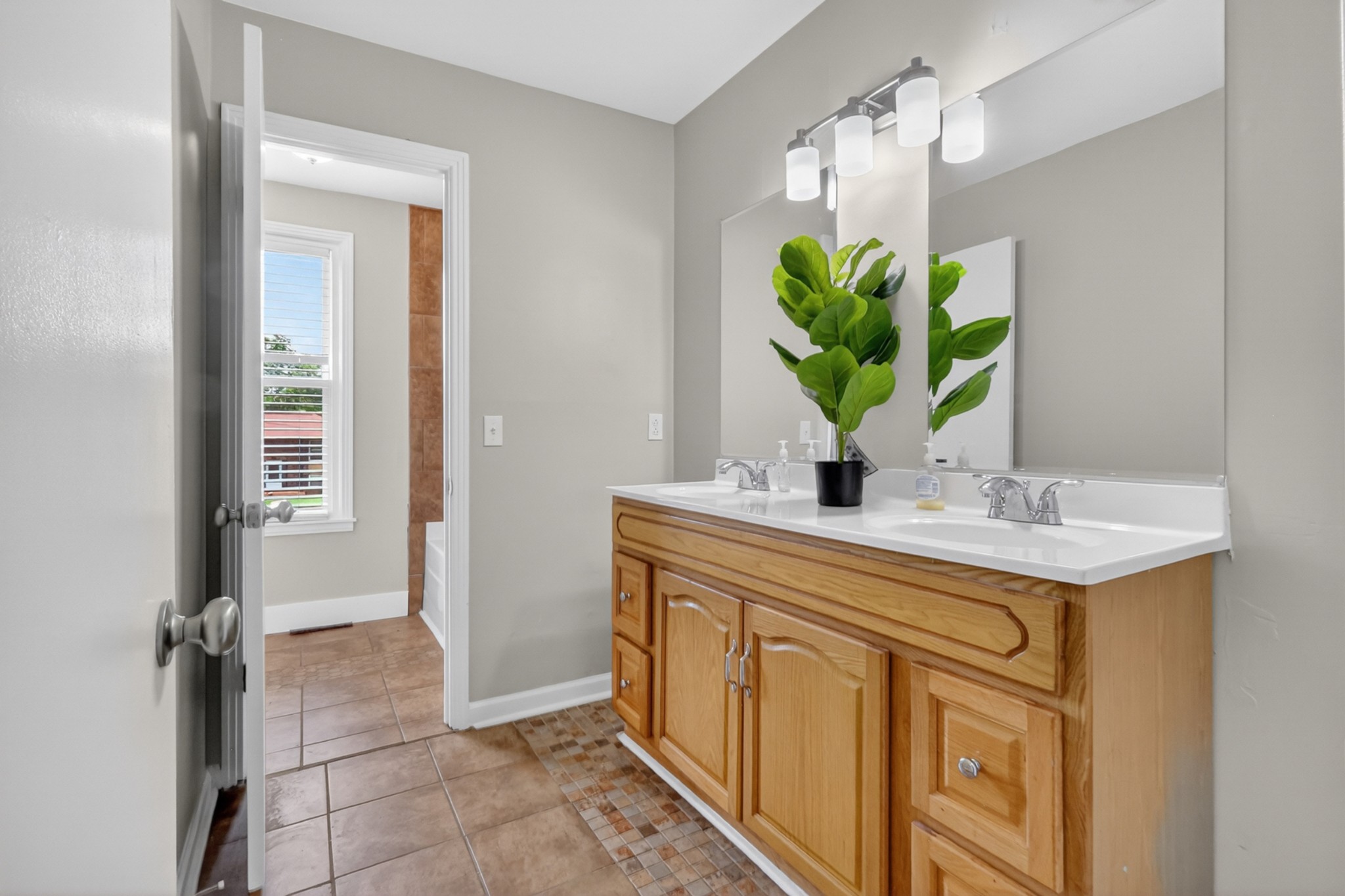 489 Canton Pass Madison, TN 37115 - Photo 13 of 25 a bathroom with a sink a vanity and a mirror