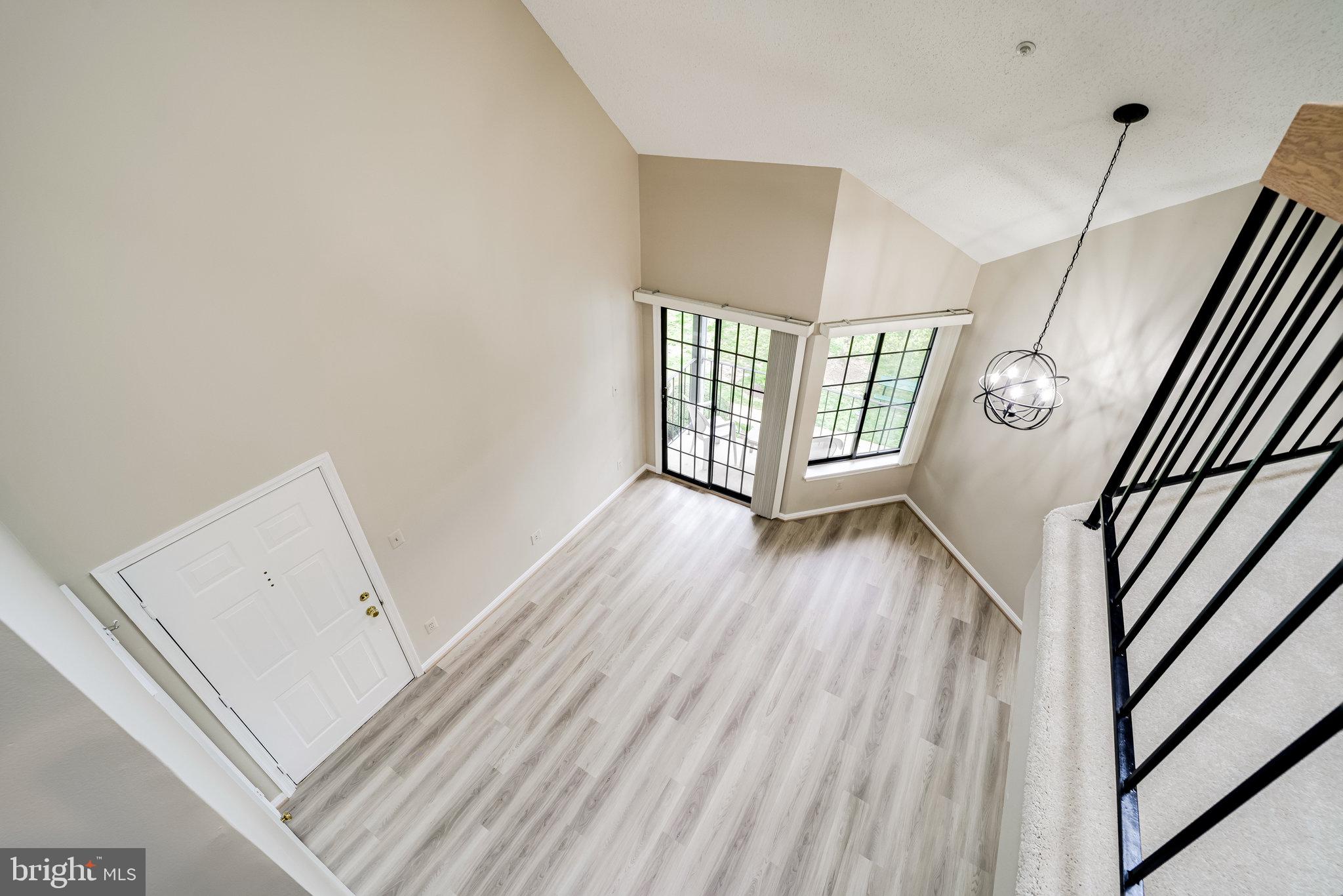 7005 E Birkenhead Place, Unit E Alexandria, VA 22315 - Photo 16 of 21 a view of an entryway with wooden floor