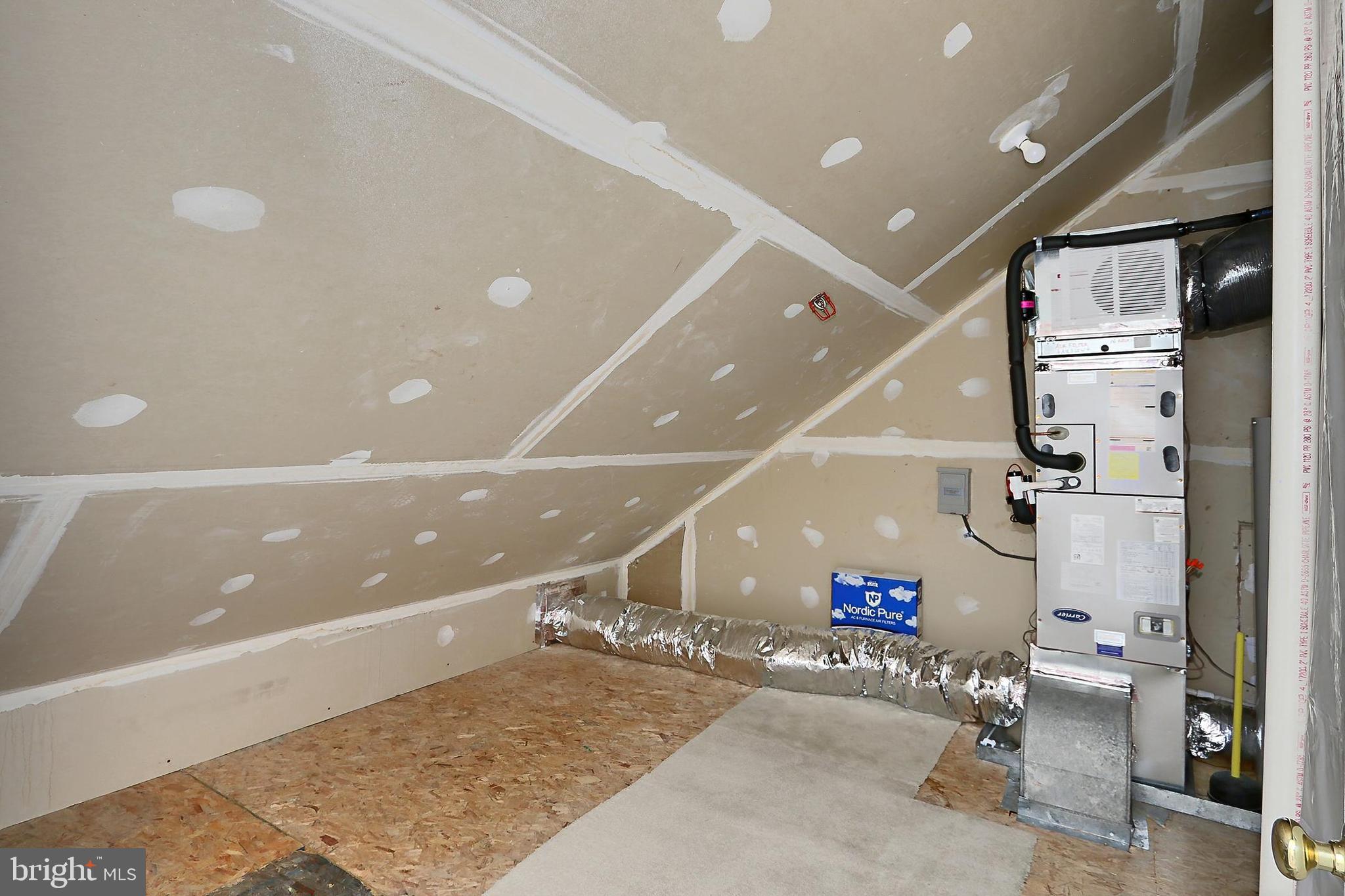 7005 E Birkenhead Place, Unit E Alexandria, VA 22315 - Photo 17 of 21 an empty room with gym equipment and a view of living room