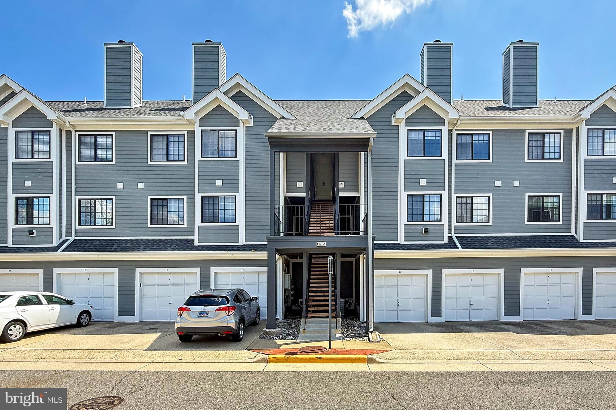 7005 E Birkenhead Place, Unit E Alexandria, VA 22315 - Photo 2 of 21 a car parked in front of a building