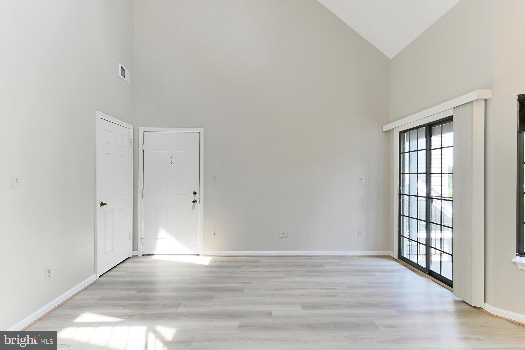 7005 E Birkenhead Place, Unit E Alexandria, VA 22315 - Photo 4 of 21 wooden floor in an empty room