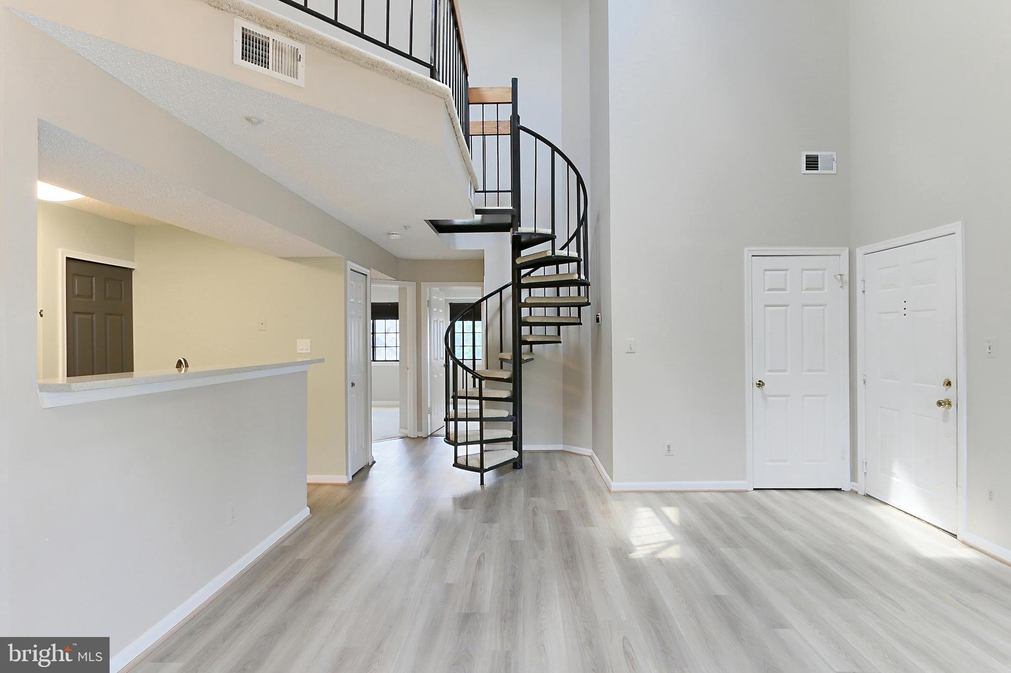 7005 E Birkenhead Place, Unit E Alexandria, VA 22315 - Photo 5 of 21 a view of an entryway with wooden floor