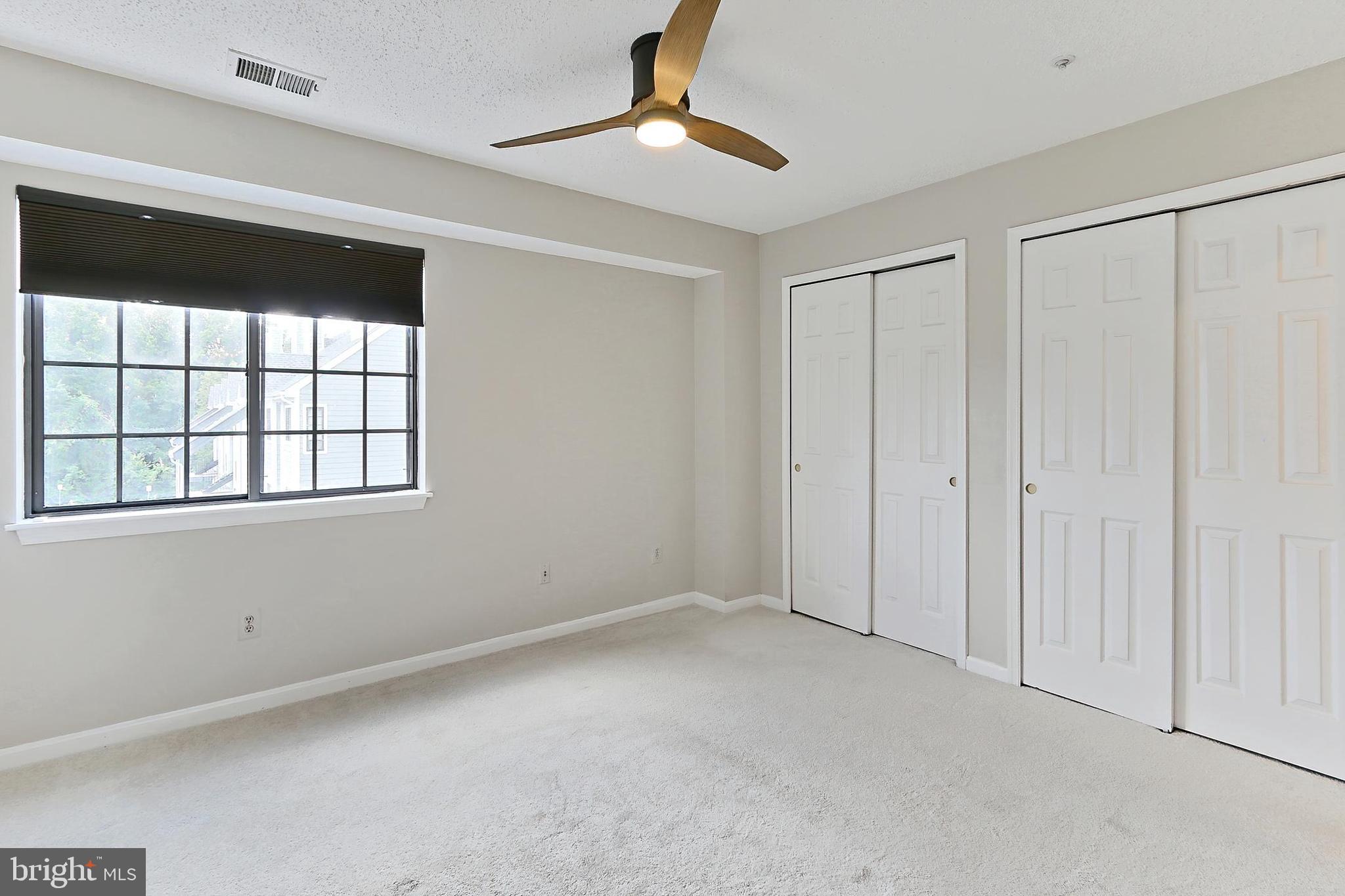 7005 E Birkenhead Place, Unit E Alexandria, VA 22315 - Photo 8 of 21 a view of an empty room with a window