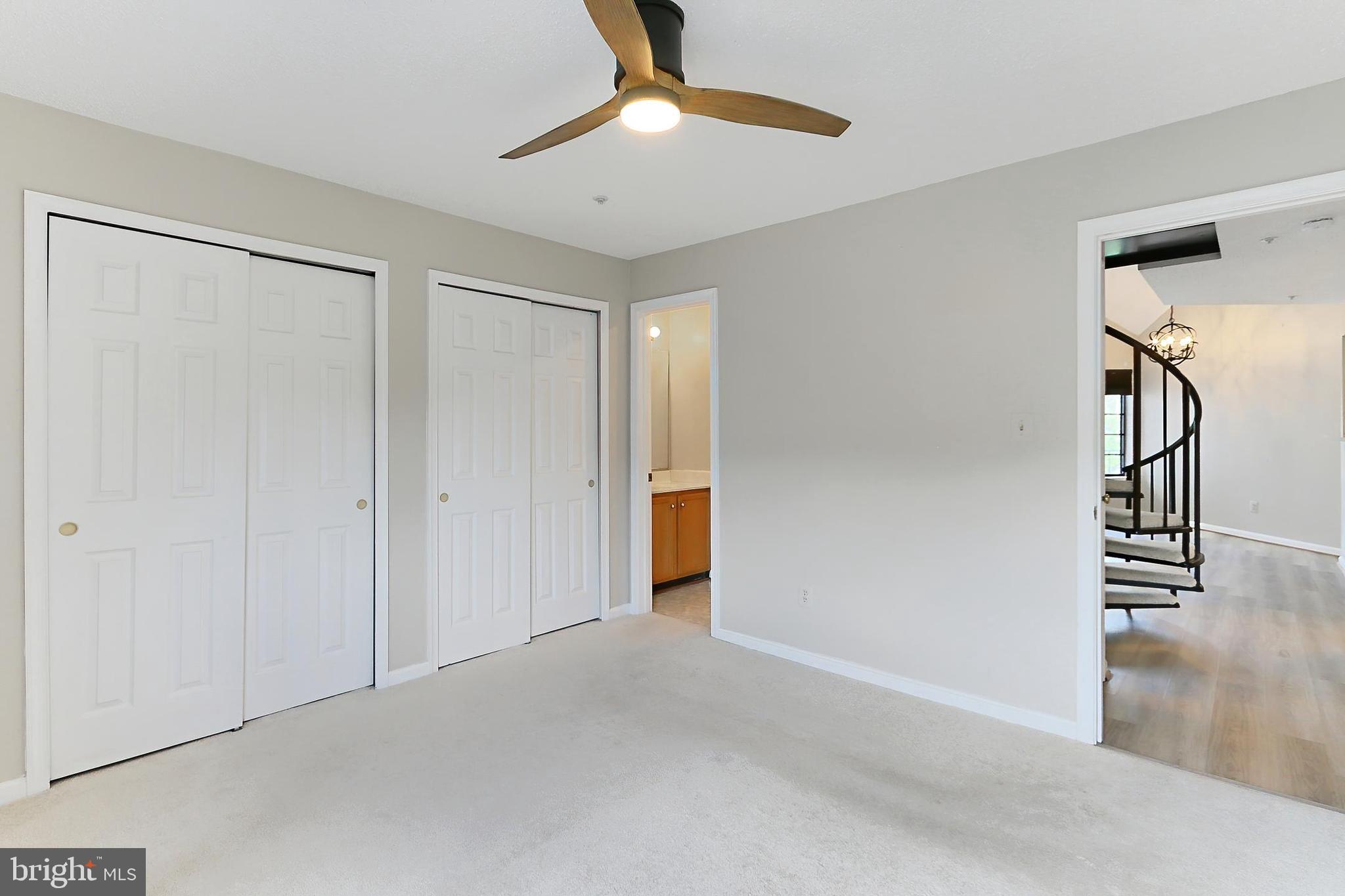 7005 E Birkenhead Place, Unit E Alexandria, VA 22315 - Photo 9 of 21 a view of empty room with wooden floor