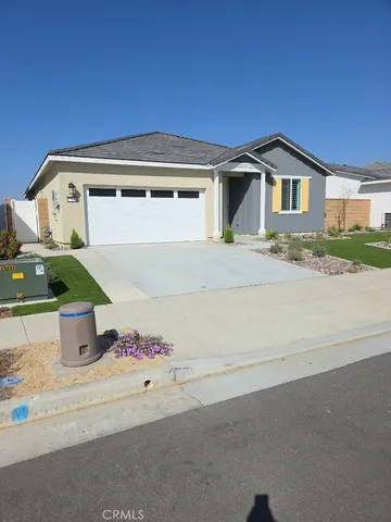 a front view of a house with a garage