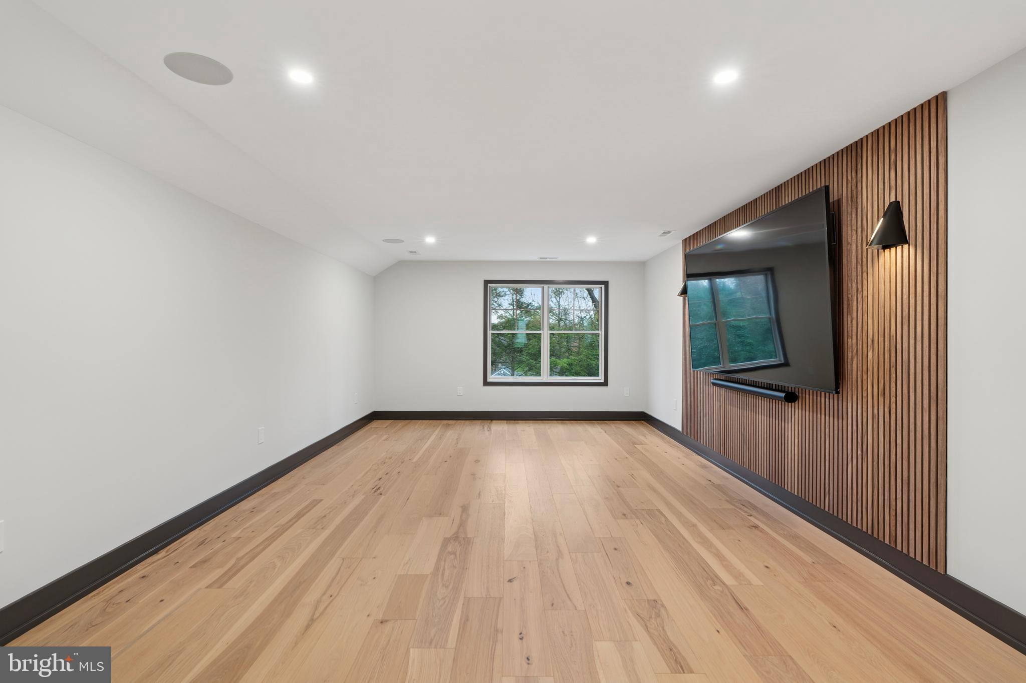 211 Bella Vista Road Devon, PA 19333 - Photo 15 of 16 wooden floor in an empty room with a window